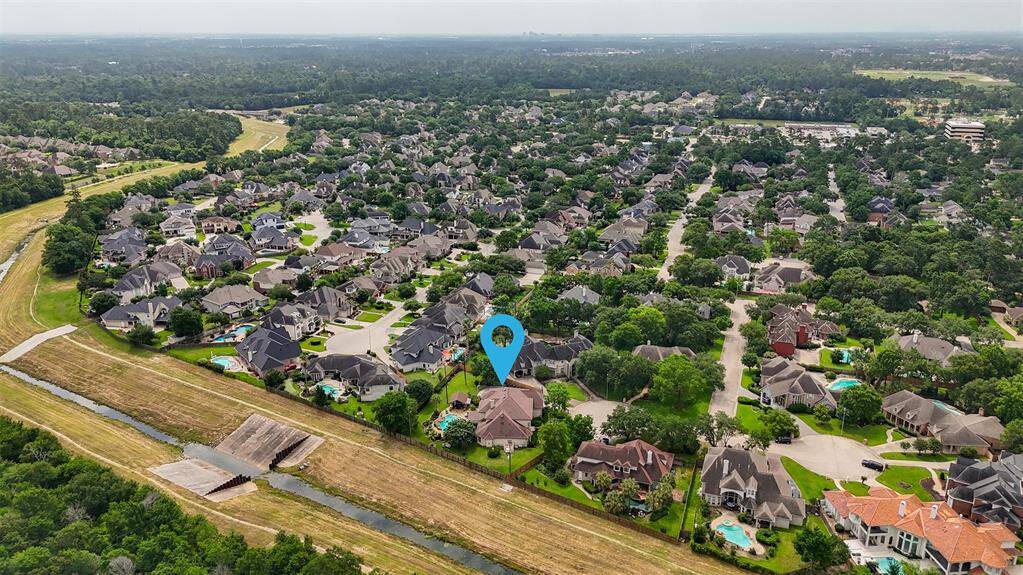 Nestled in the tranquil Wimbledon Centre Court Estates, this home offers a rare sense of privacy and serenity—enhanced by the added benefit of no back neighbors.