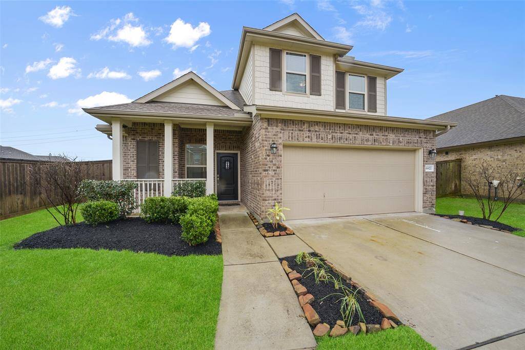 This charming home features a welcoming front porch, a perfect combination of comfort and curb appeal!