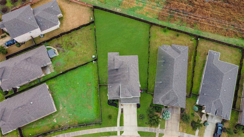 This backyard is perfect for families seeking ample outdoor space, and no back neighbors insures privacy.