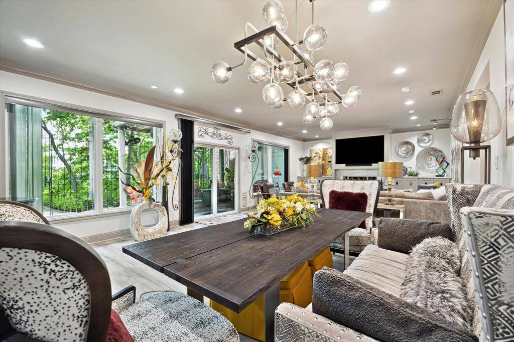 The huge windows overlook the private backyard and beautiful gardens