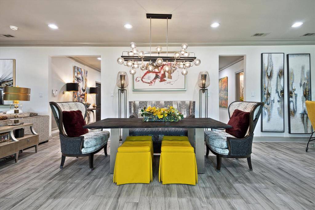 Dining area with easy access to the kitchen.  Notice the designer light fixtures.
