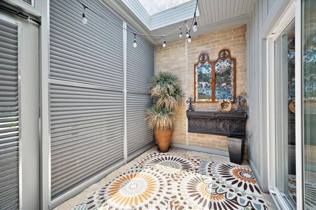 Small courtyard area which leads to carport and a utility room
