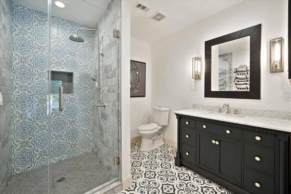 En-suite first floor secondary bath with designer tile