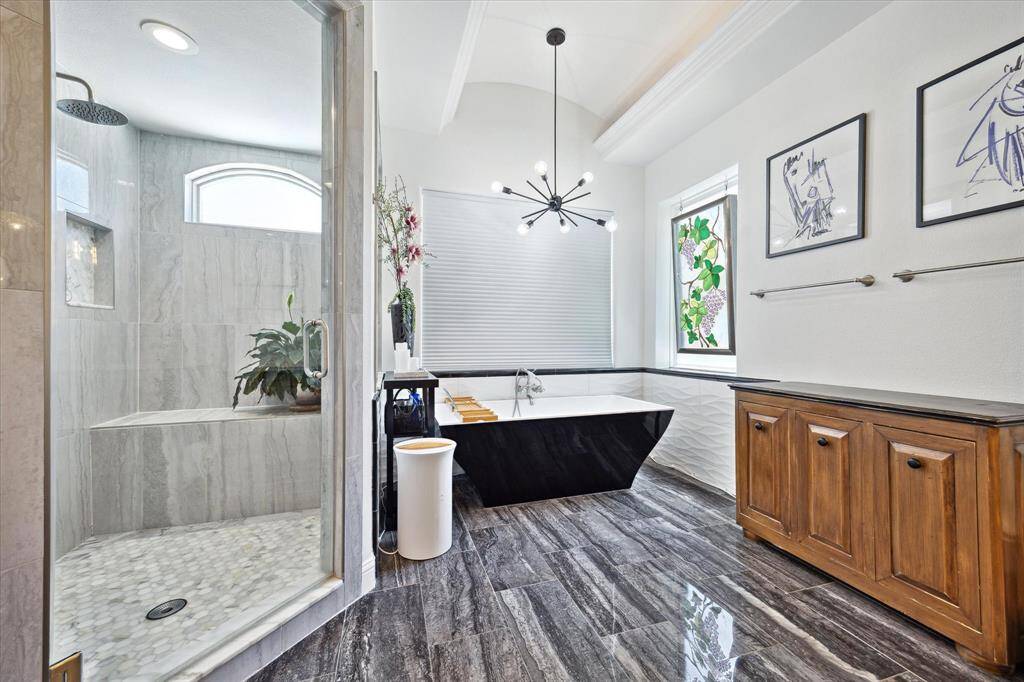 Spa-like primary bath with soaking tub and separate shower
