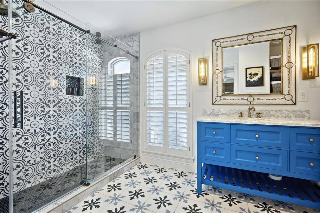 Secondary bath with designer tile, oversized shower and custom vanity