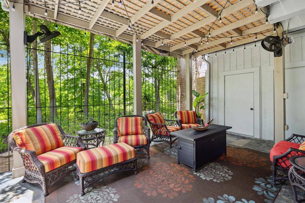 Another view of the covered pergola and two large storage closets