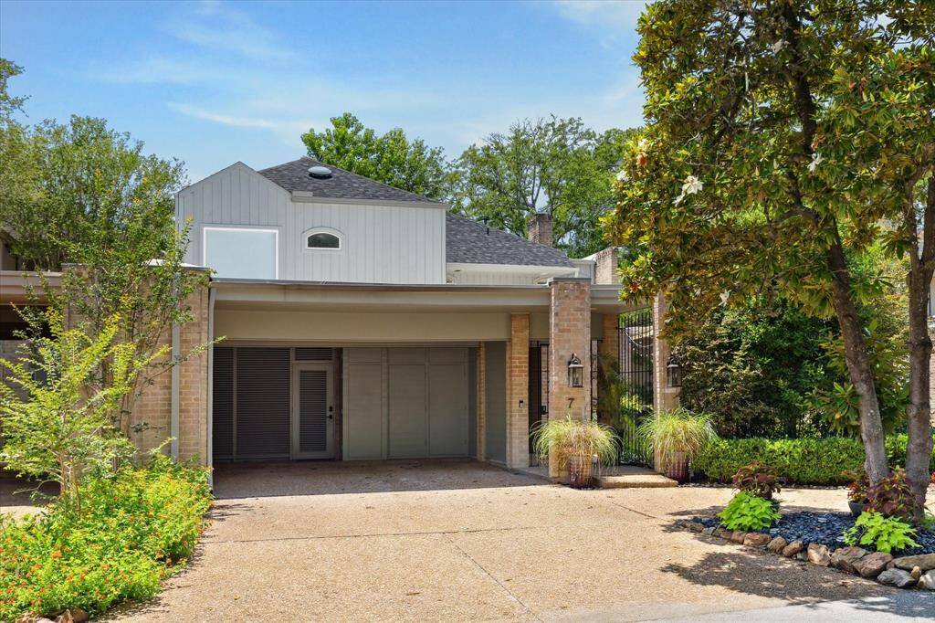 Two car carport with EV charging and built-in storage closets. 7 Woodstone a wonderful place to call home in the heart of Memorial.