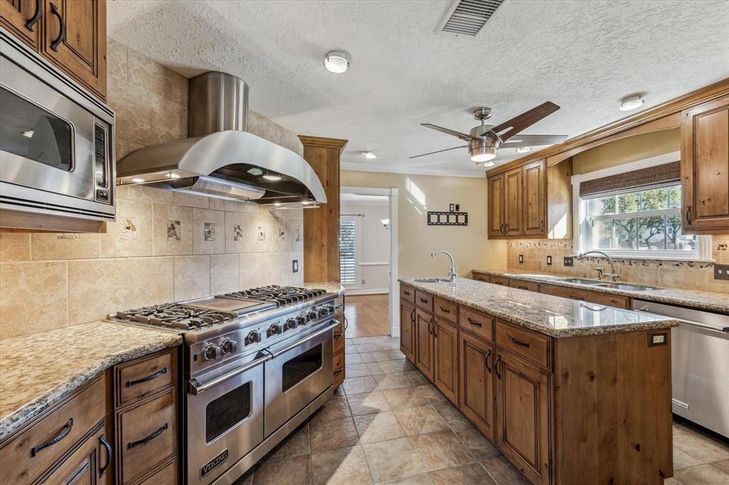 Incredible chef's kitchen with Viking appliances, solid wood, custom cabinets and so much space!