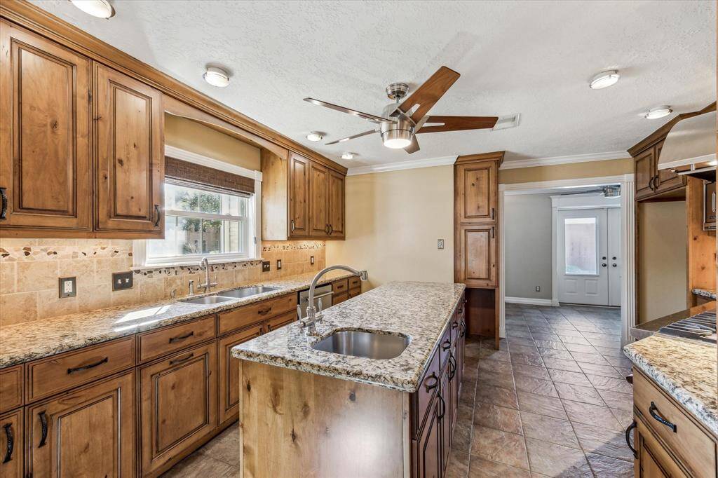 Another view of this incredible kitchen with two sinks!