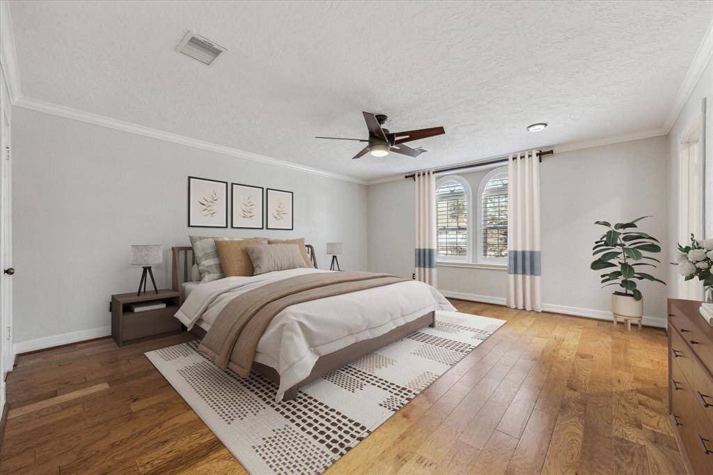 *Virtually staged primary bedroom upstairs with custom wood shutters and tons of natural light!