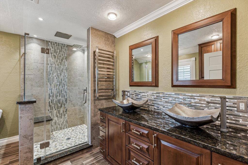 Beautifully updated primary bath with separate shower.