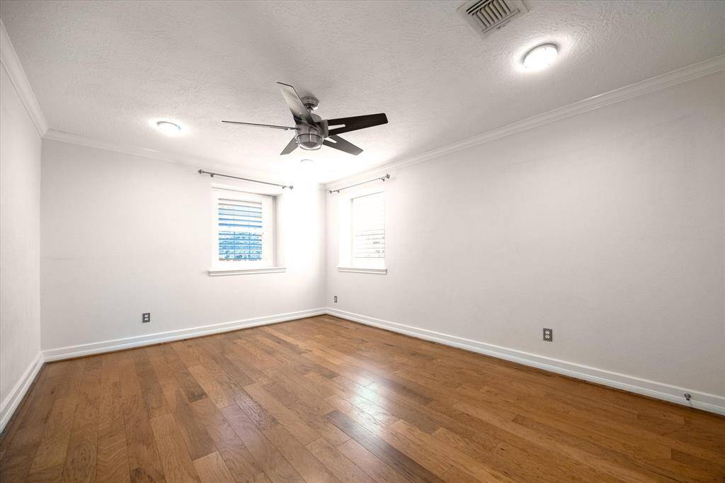 One of three large secondary bedrooms. All secondary bedrooms have walk-in closets with custom built ins.
