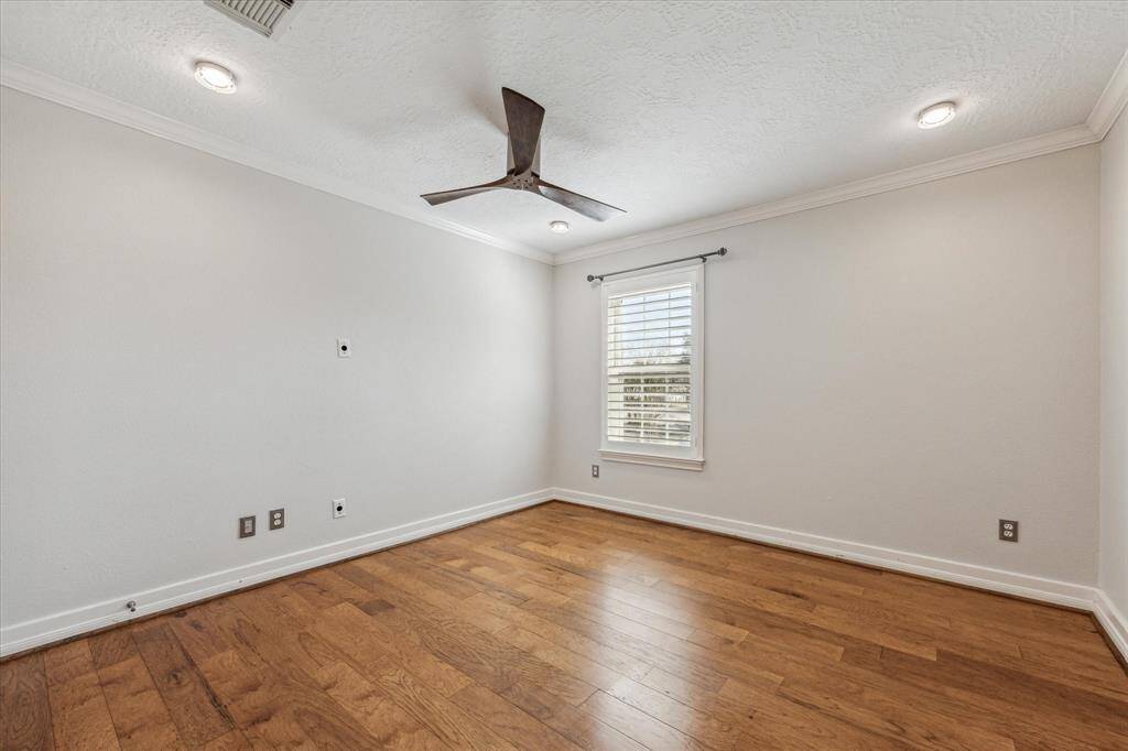 One of three large secondary bedrooms. All secondary bedrooms have walk-in closets with custom built ins.