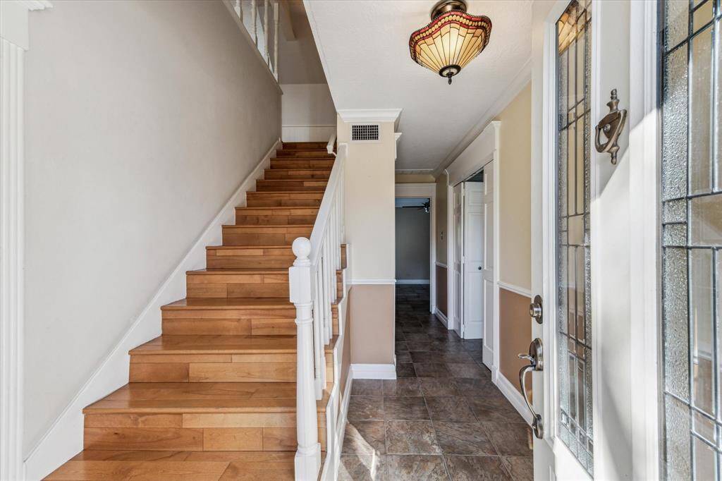 Second stair case and home entry on the side of the house that leads to the game room.