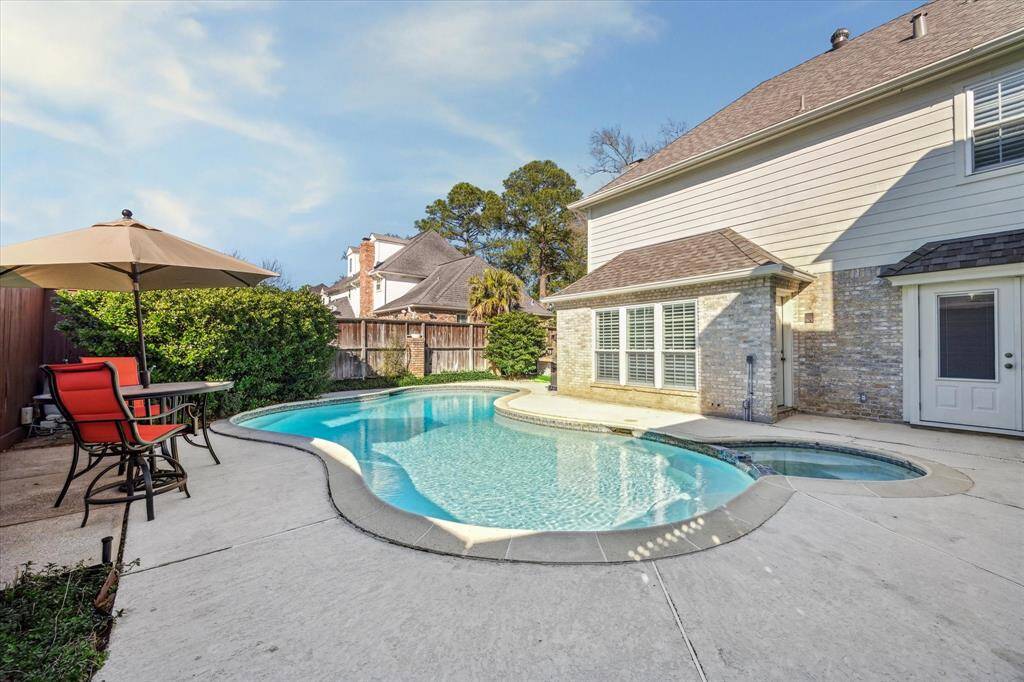 Beautiful sparkling pool in your backyard oasis.