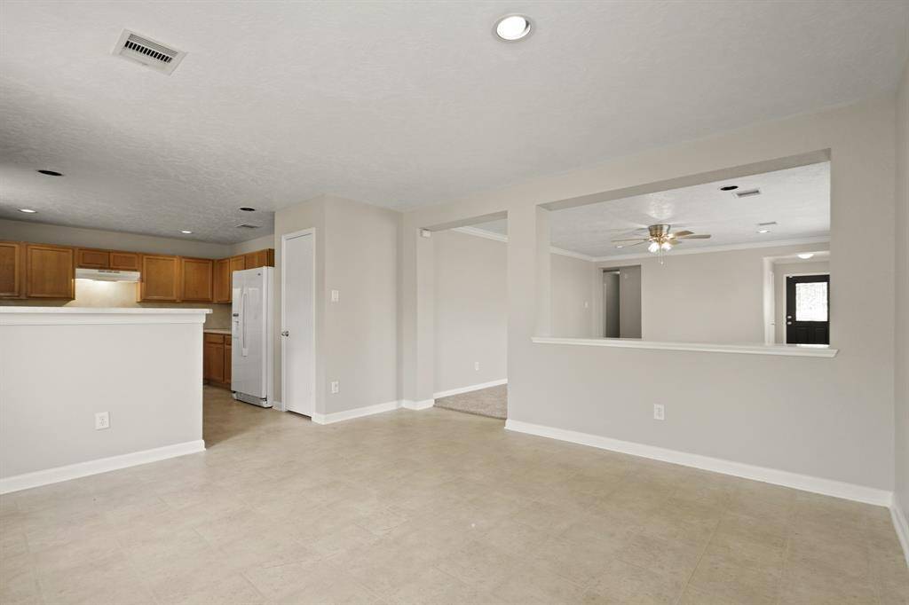 The spacious breakfast area is perfect for your morning coffee, and is open to both the kitchen and the living room.