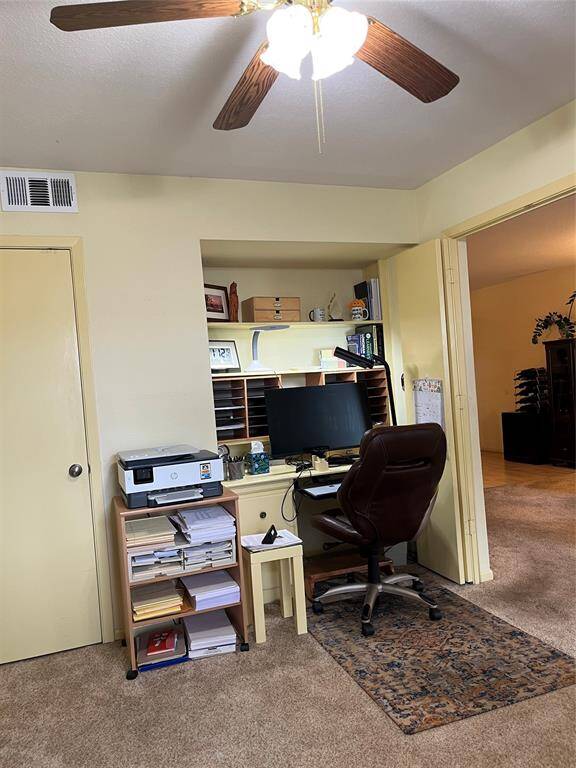 The 2nd View Of The Home Office/Guest Bedroom.  Featuring A Walk In Closet, Double Paned Windows & Ceiling Fan.