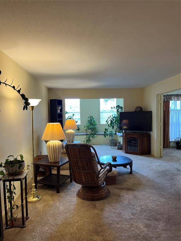 Walk Into The Extra Large Living Room.  Sunroom Was Enclosed With Window Bench Seating, Double Paned Windows & Newer A/C (2018-2019)..
