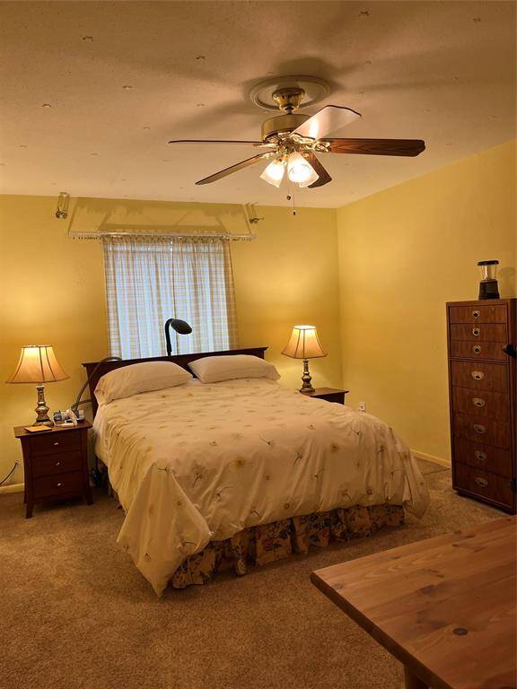 The Kitchen Features A Glass Cooktop Stove, Built-In Microwave, Newer Dishwasher & Newer Stainless Steel Refrigerator That Stays With The Propery.