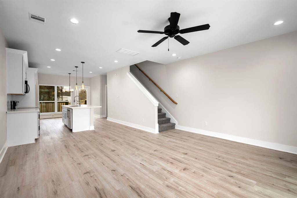 Living area on 1st floor. Open concept living. Stairs to 2nd floor.