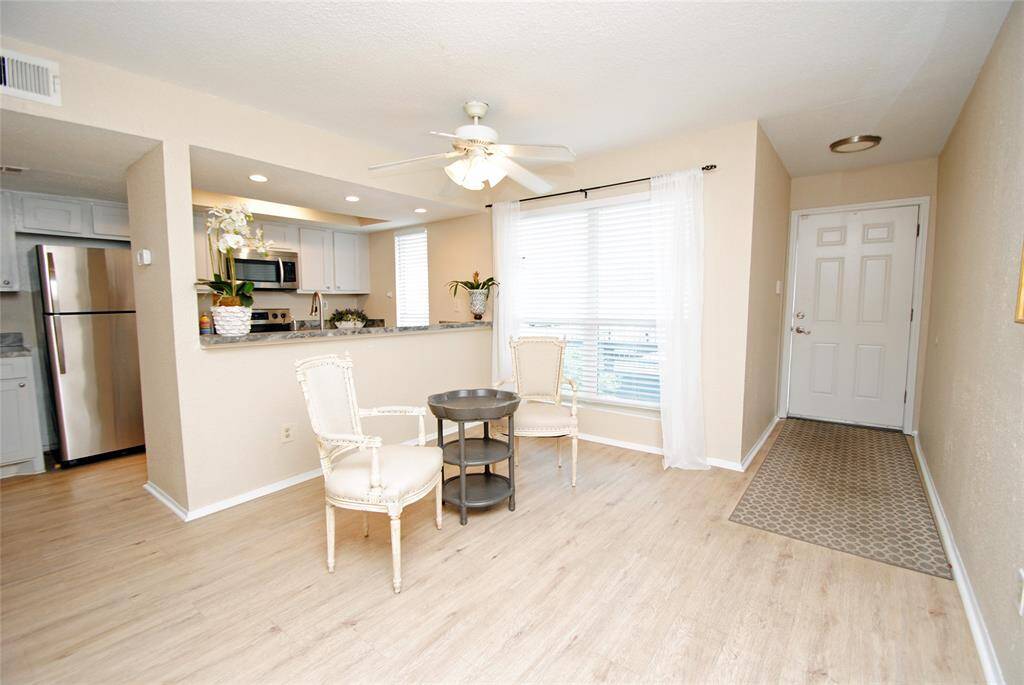 Natural light flow thru inviting open Kitchen, Dining and breakfast bar. Right Front door only steps from 2 dedicated parking spots.