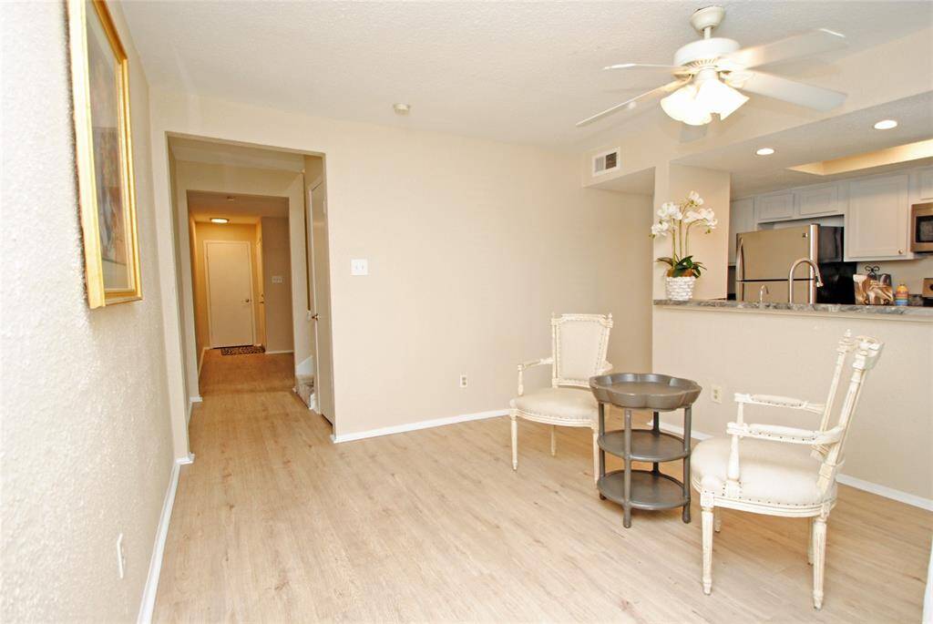 Walk thru the doorway entering a large open Living room.