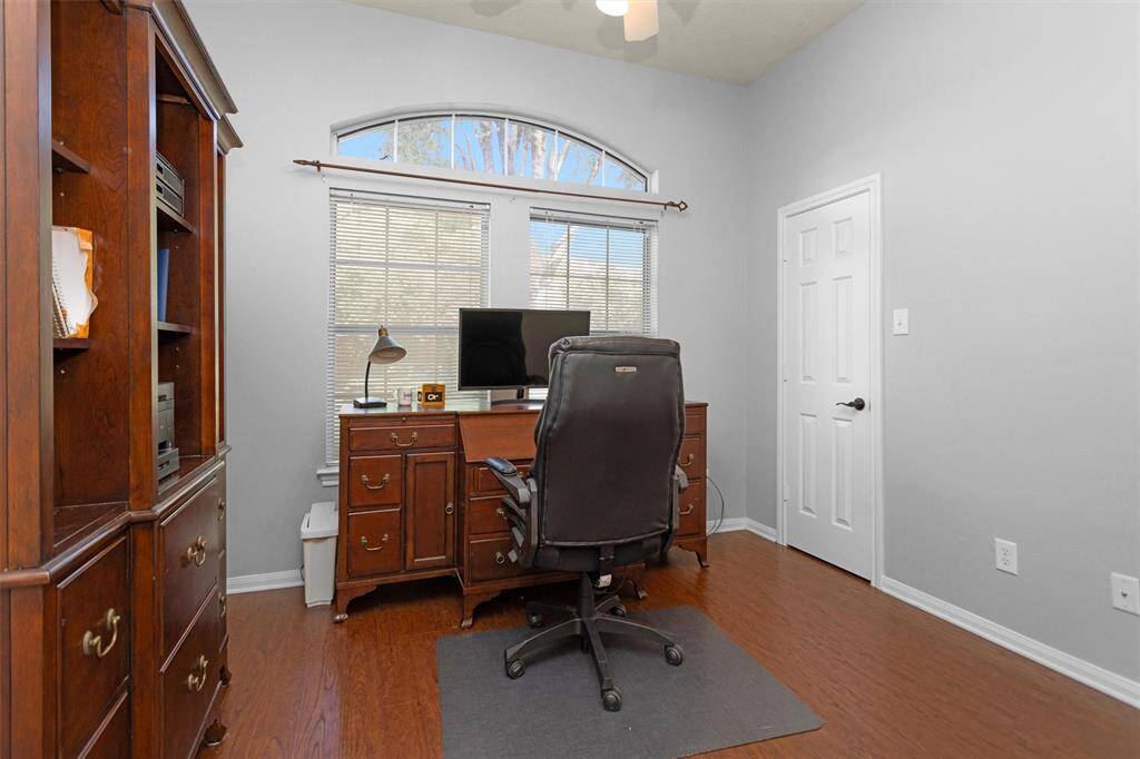 Middle bedroom with gorgeous wood floors.