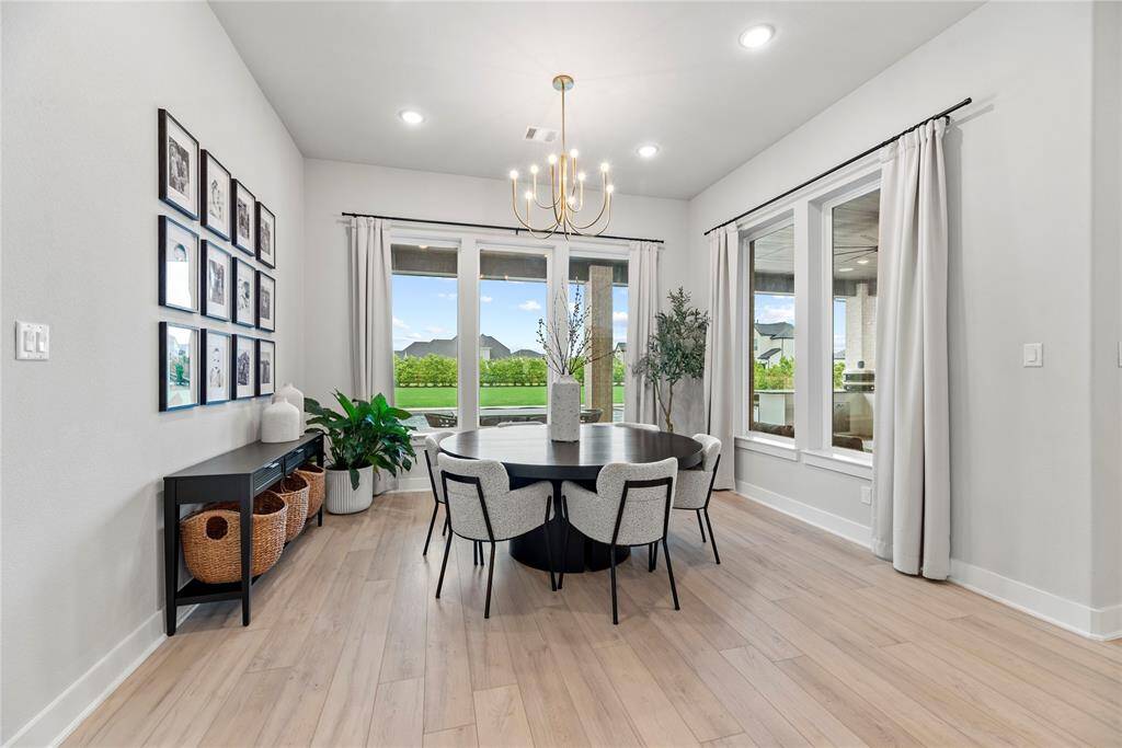 The dining area, conveniently located next to the kitchen and living room, offers plenty of space for a large table—perfect for family meals and gatherings!