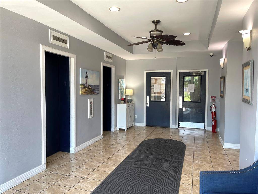 CONDO BUILDING ENTRY FOYER, 2 ELEVATORS FOR CONDO OWNERS, ALSO DOOR TO ENTER COVERED GARAGE PARKING
