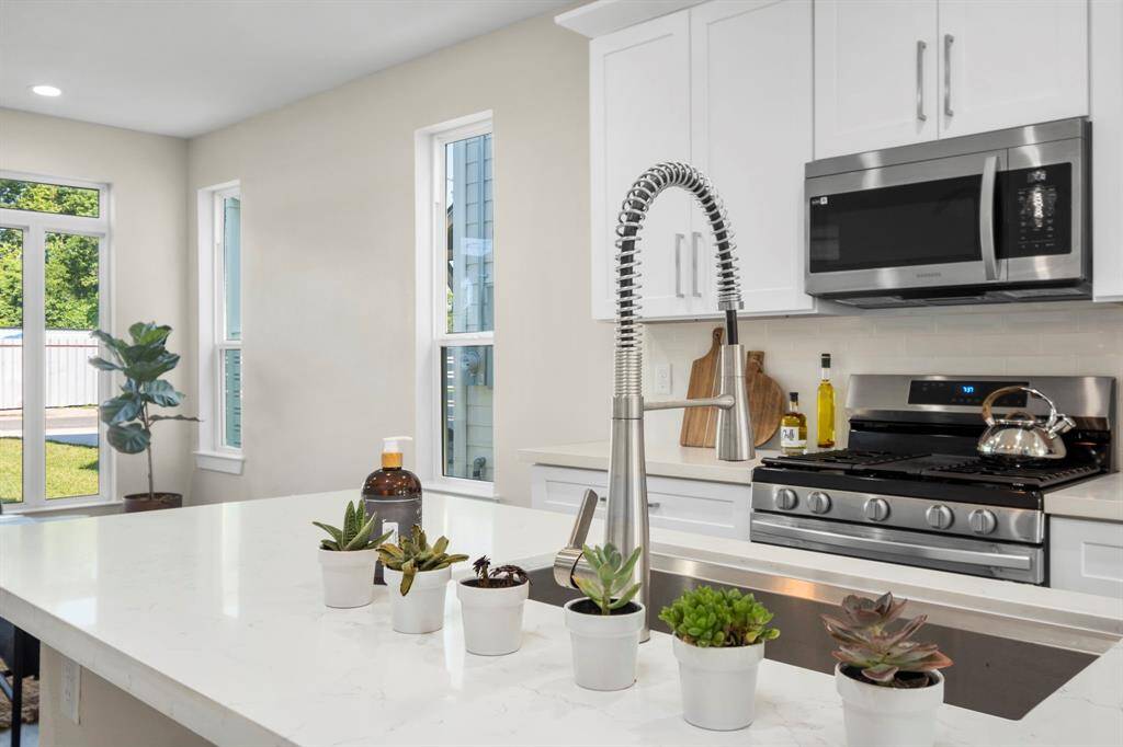 Kitchen detail. Island w/ Quartz countertops.