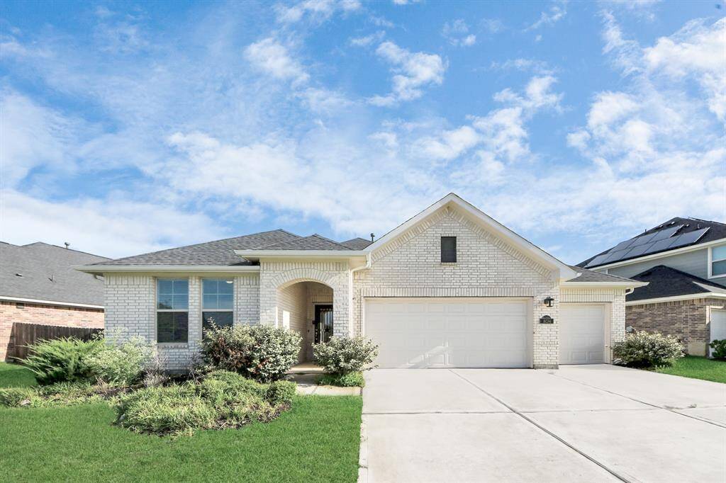Front view highlighting elegant large fron of the house and extra large driveway.