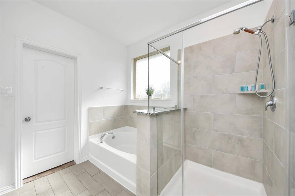 Primary separate tub and shower.