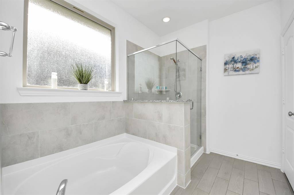Primary separate tub and shower.