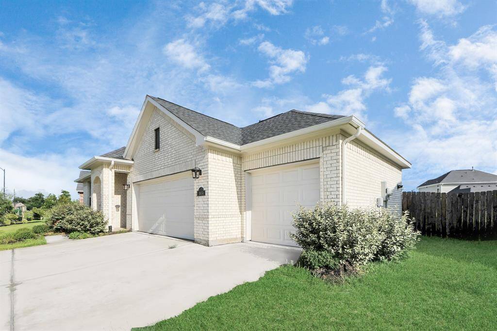 Front view highlighting elegant large fron of the house and extra large driveway.
