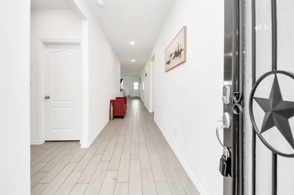 Front door entrance hallway with lots of space and natural light.