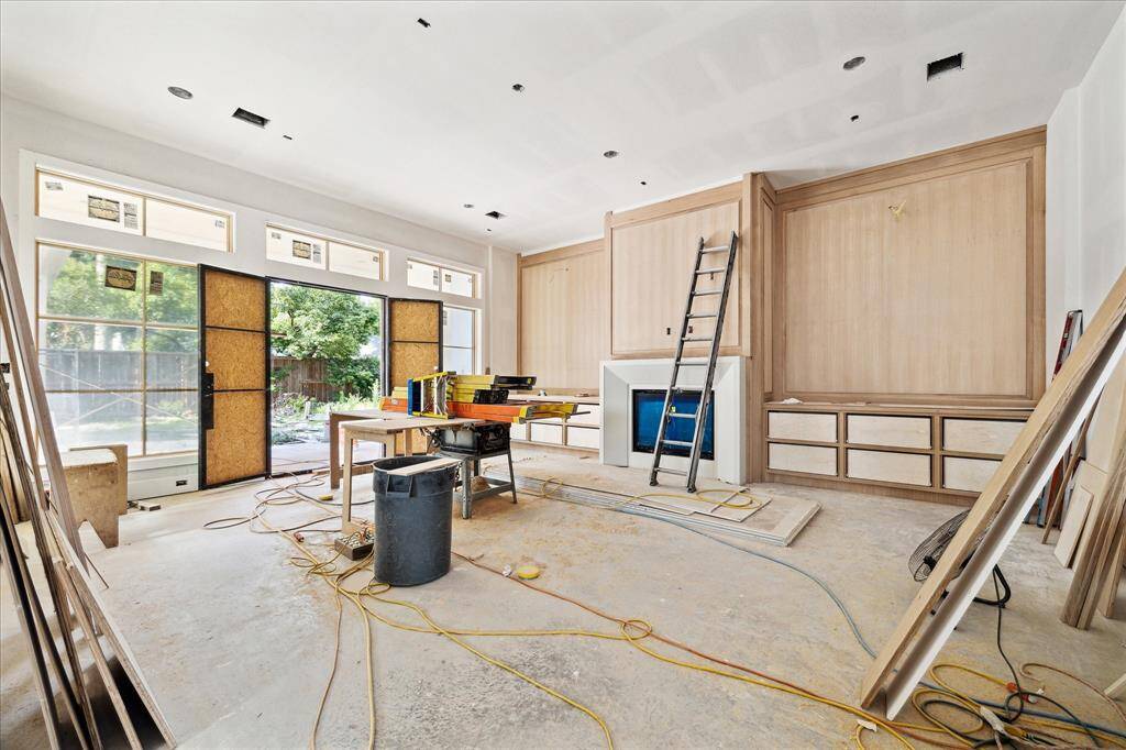 Large living room overlooking the backyard oasis.  Construction as of May 24