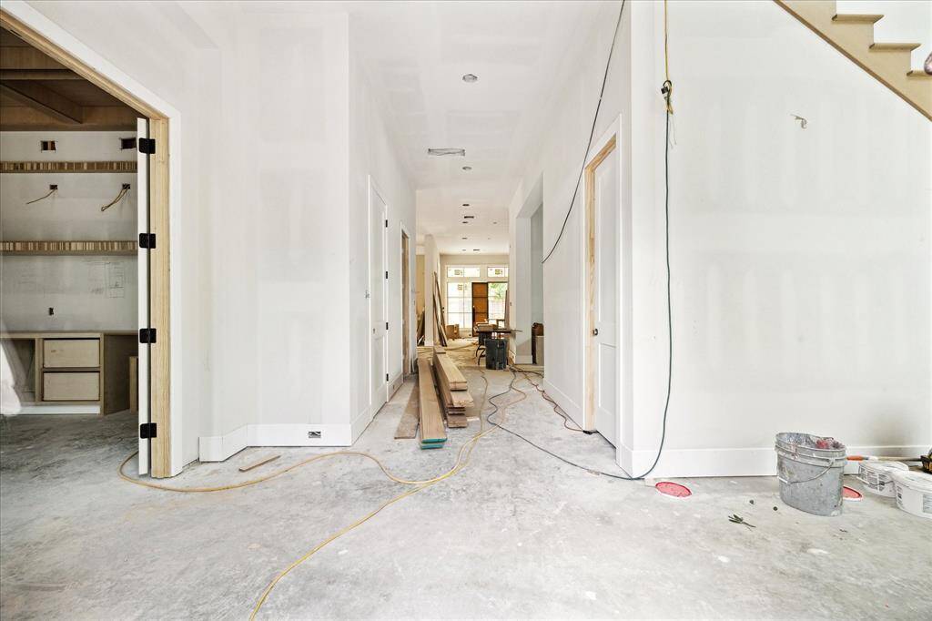 Dramatic entry foyer with a 36 foot ceiling. Comfortable luxury and sophication throughout this home. Construction as of May 24.