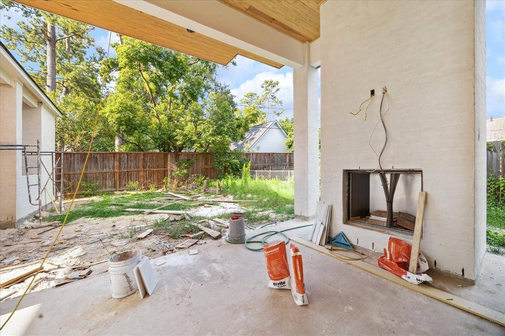 Soon to be the backyard of your dreams.  Large covered patio with fireplace, pool size yard, outdoor grill area, half bath and additional covered area, perfect for entertaining and family time.  Construction as of May 24