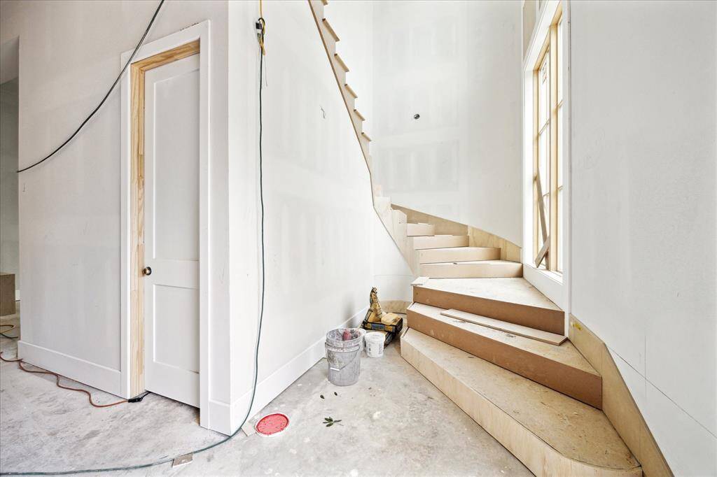 Grand staircase to the right of the entry. Construction as of May 24.