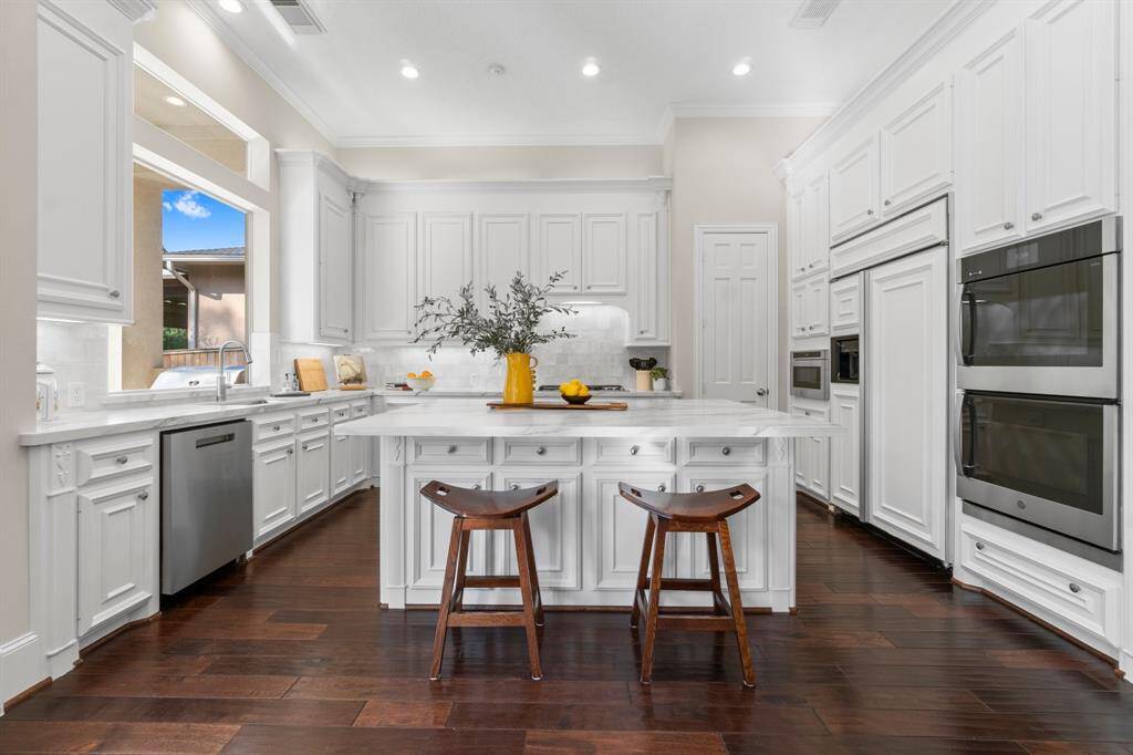 Gourmet kitchen is a dream with a huge island & tons of cabinet space