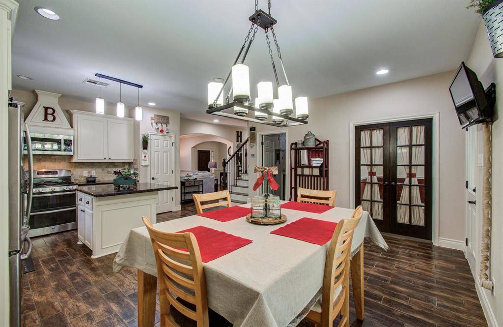 The dining area is very spacious, and is surrounded by LED recessed lighting & chandelier.