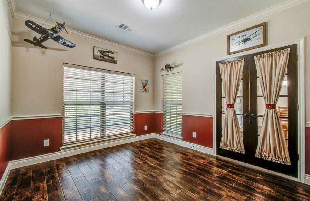 This spacious versatile flexible use room has endless possibilities; an office/study, a nursery, a possible first floor 5th bedroom; room features good amounts of natural lighting from separate sets of windows and the dual French door entry with glass inserts adds a special touch to this area.