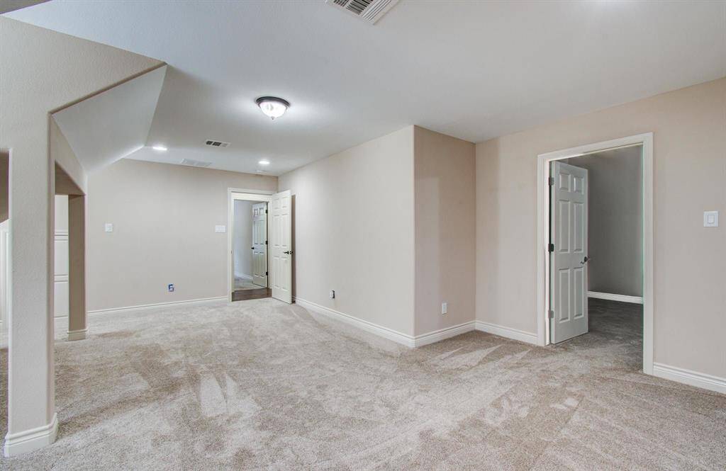 The second bedroom is very spacious and can easily double as an upstairs game room.