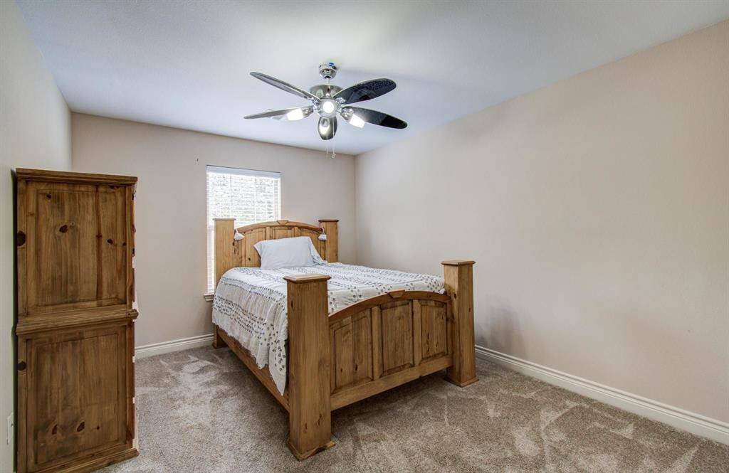 Upstairs spacious 3rd bedroom with upgraded ceiling fan with LED lighting.