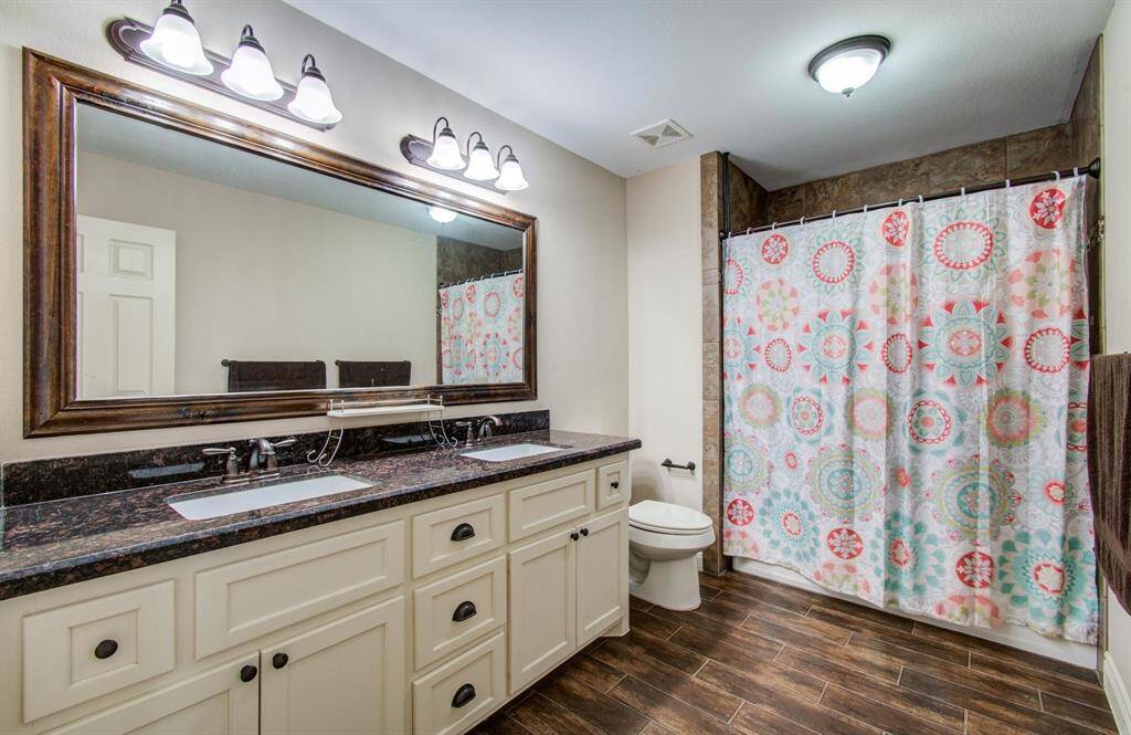 Upstairs full bath, with upgraded ceramic floor to ceiling tile backsplash for tub/shower area. Also very nice dual vanity with good amounts of drawers and cabinetry storage space.