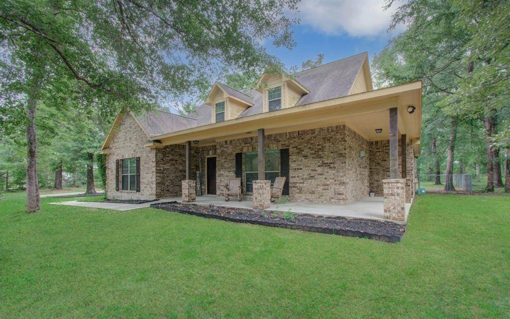 The extended front covered porch is great for real tranquility, peace and lounging.
