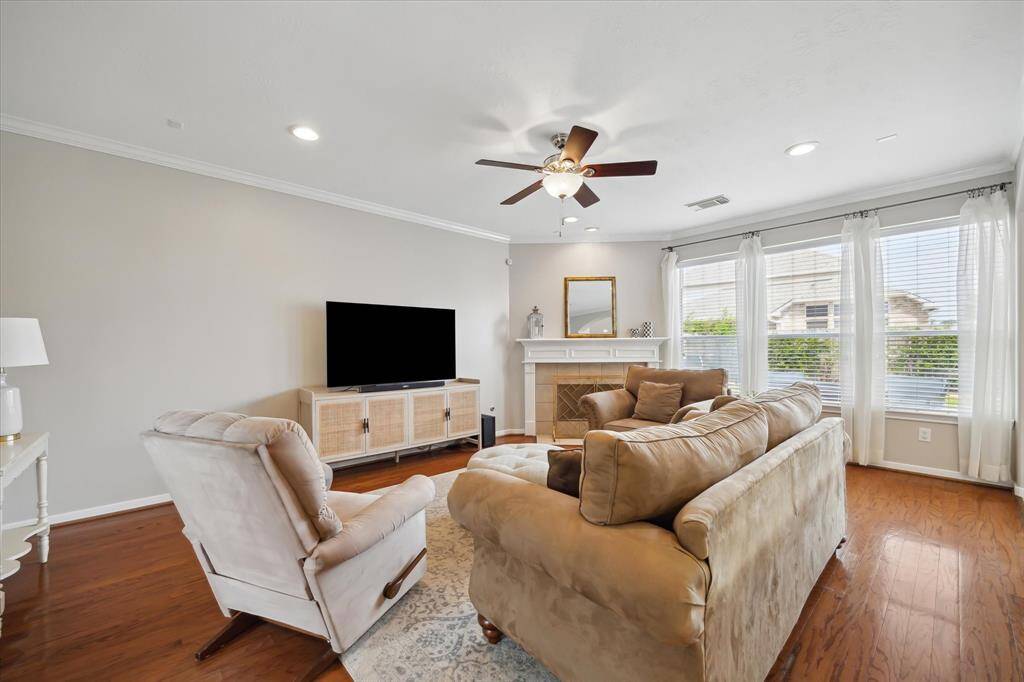 Expansive living room with gaslog fireplace off of kitchen