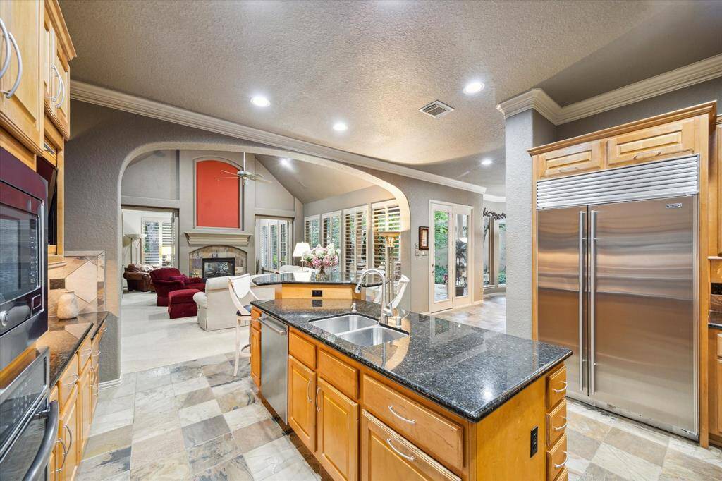 Kitchen with view into open living area