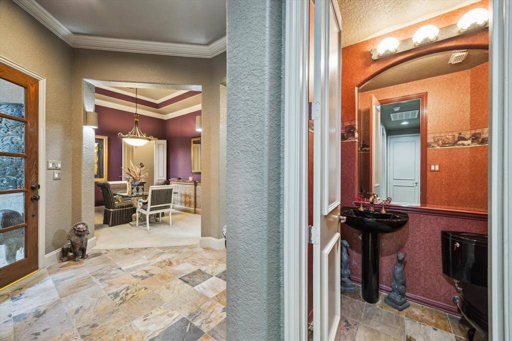 1/2 Bath off of entry way, down back hallway.