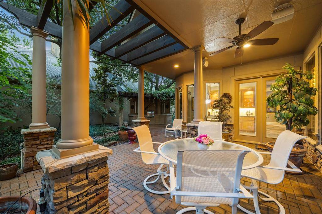 Covered back patio with view to outdoor kitchen